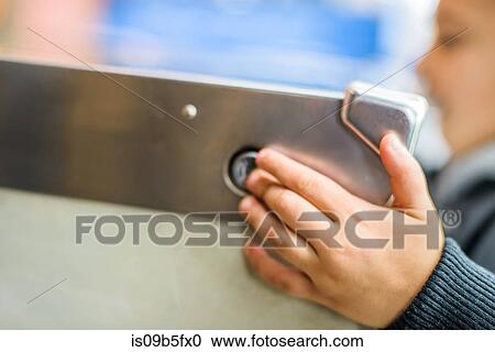 Cropped view of boy's hand pressing button on pinball machine View Large Photo Image Stock Image - Cropped view of boy's hand pressing button on pinball machine. Fotosearch