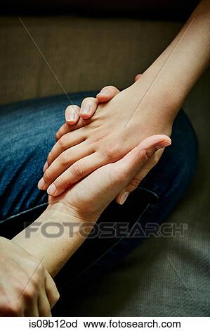 Cropped view of mother and son holding hands View Large Photo Image Stock Image - Cropped view of mother and son holding hands. Fotosearch