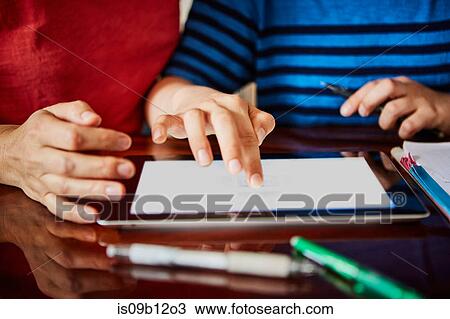 Cropped view of mother and son using digital tablet View Large Photo Image Stock Image - Cropped view of mother and son using digital tablet. Fotosearch