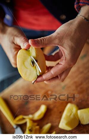 Cropped view of woman chopping apple View Large Photo Image Stock Image - Cropped view of woman chopping apple. Fotosearch