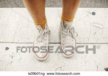 Cropped view of womans feet wearing socks and high tops View Large Photo Image Stock Image - Cropped view of womans feet wearing socks and high tops. Fotosearch