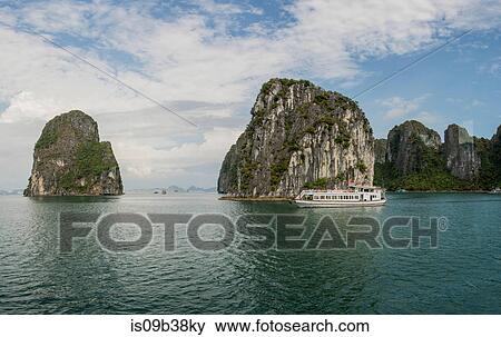 Cruise boat in waters of Ha Long Bay, Vietnam View Large Photo Image Stock Photo - Cruise boat in waters of Ha Long Bay, Vietnam. Fotosearch