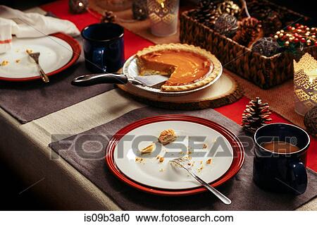 Stock Image - Crumbs on plate at festive place setting. Fotosearch