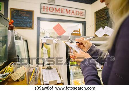 Customer filling order form in general store, Hague, USA View Large Photo Image Stock Image - Customer filling order form in general store, Hague, USA. Fotosearch