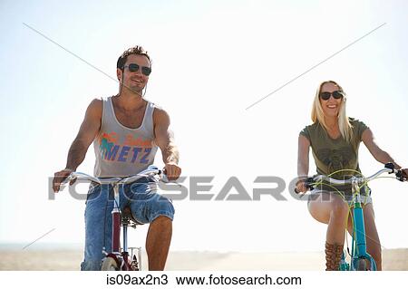 Cycling couple cycling on Venice Beach, Los Angeles, California, USA View Large Photo Image Stock Image - Cycling couple cycling on Venice Beach, Los Angeles, California, USA. Fotosearch