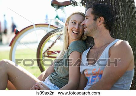 Cycling couple sitting holding hands at Venice Beach, Los Angeles, California, USA View Large Photo Image Stock Image - Cycling couple sitting holding hands at Venice Beach, Los Angeles, California, USA. Fotosearch