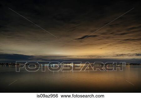 Distant view of city lights over Puget Sound at night, Seattle, Washington, USA View Large Photo Image Stock Photograph - Distant view of city lights over Puget Sound at night, Seattle, Washington, USA. Fotosearch