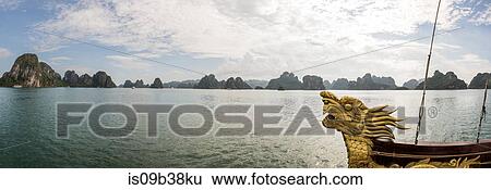 Dragon boat in waters of Ha Long Bay, Vietnam View Large Photo Image Stock Photograph - Dragon boat in waters of Ha Long Bay, Vietnam. Fotosearch