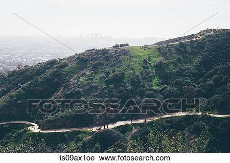 Elevated view of winding road and hills with distant smoggy cityscape, Los Angeles, California, USA View Large Photo Image Stock Image - Elevated view of winding road and hills with distant smoggy cityscape, Los Angeles, California, USA. Fotosearch