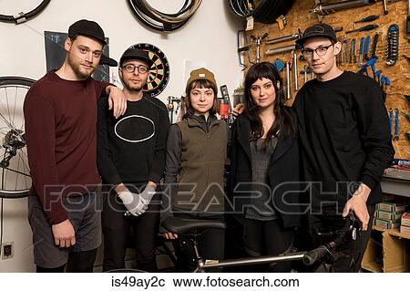 Stock Image - Employees in bicycle workshop. Fotosearch