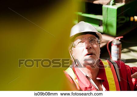 Engineer working on oil rig View Large Photo Image Picture - Engineer working on oil rig. Fotosearch