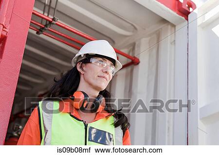 Engineer working on oil rig View Large Photo Image Stock Image - Engineer working on oil rig. Fotosearch