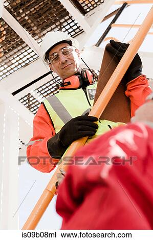 Engineer working on oil rig View Large Photo Image Stock Image - Engineer working on oil rig. Fotosearch