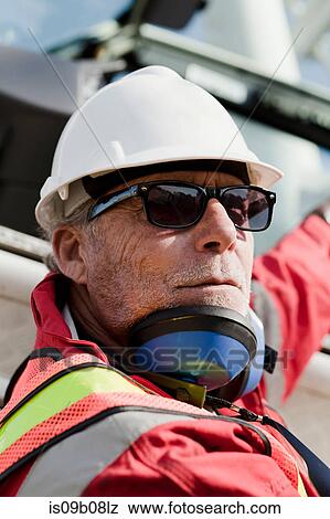Engineer working on oil rig View Large Photo Image Stock Photo - Engineer working on oil rig. Fotosearch