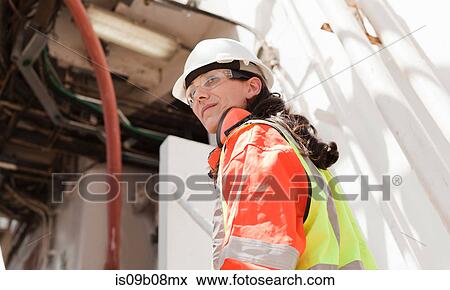 Engineer working on oil rig View Large Photo Image Stock Photo - Engineer working on oil rig. Fotosearch