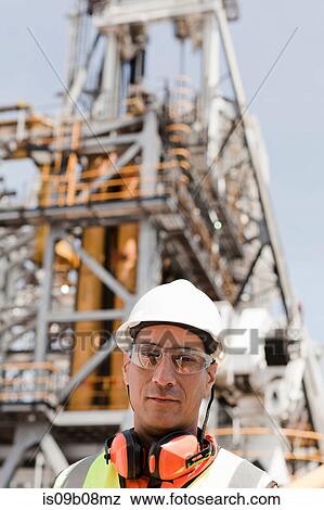 Engineer working on oil rig View Large Photo Image Stock Photo - Engineer working on oil rig. Fotosearch