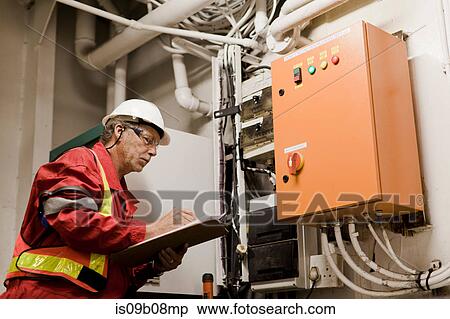 Engineer working on oil rig View Large Photo Image Stock Photography - Engineer working on oil rig. Fotosearch