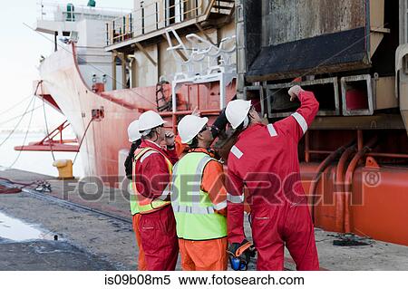 Engineers in brainstorming session on oil rig View Large Photo Image Stock Photography - Engineers in brainstorming session on oil rig. Fotosearch