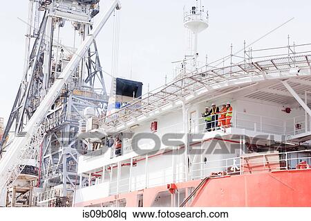 Engineers in discussion on oil rig View Large Photo Image Stock Photography - Engineers in discussion on oil rig. Fotosearch