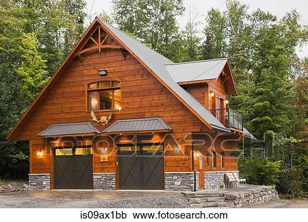Exterior of cottage style Eastern white pine log house with double garage View Large Photo Image Stock Image - Exterior of cottage style Eastern white pine log house with double garage. Fotosearch