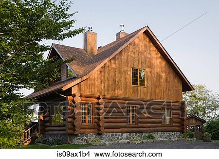 Exterior of cottage style log house with cedar shingles View Large Photo Image Picture - Exterior of cottage style log house with cedar shingles. Fotosearch