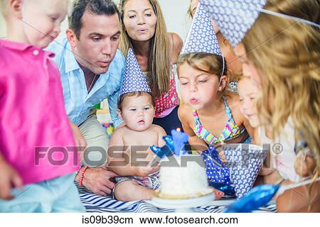 Picture - Family at birthday celebration. Fotosearch