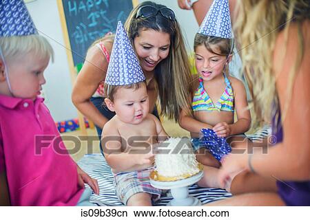 Picture - Family at birthday celebration. Fotosearch