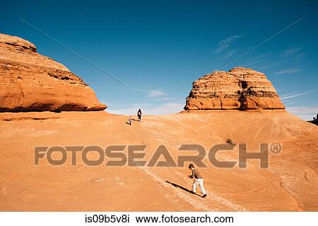 Family exploring in desert, Moab, Utah, USA View Large Photo Image Stock Image - Family exploring in desert, Moab, Utah, USA. Fotosearch