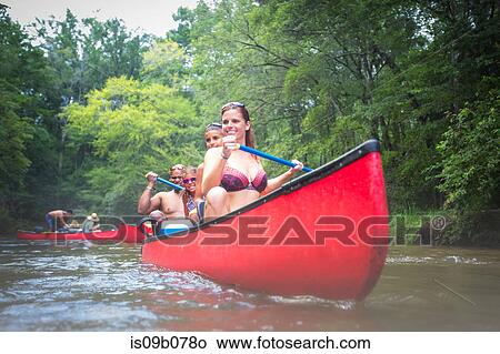 Family on a canoe trip together at Econfina Spring, Florida, USA View Large Photo Image Picture - Family on a canoe trip together at Econfina Spring, Florida, USA. Fotosearch