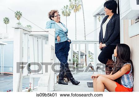 Family on porch talking View Large Photo Image Stock Image - Family on porch talking. Fotosearch