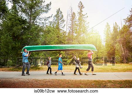 Family with four children carrying canoe, Grand Teton National Park, Wyoming, USA View Large Photo Image Stock Photo - Family with four children carrying canoe, Grand Teton National Park, Wyoming, USA. Fotosearch
