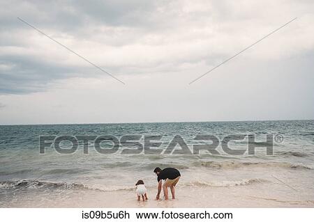 Father and daughter playing on beach, Cancun, Mexico View Large Photo Image Stock Image - Father and daughter playing on beach, Cancun, Mexico. Fotosearch