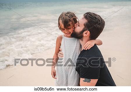 Father kissing daughter on beach, Cancun, Mexico View Large Photo Image Picture - Father kissing daughter on beach, Cancun, Mexico. Fotosearch