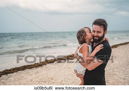 Father kissing daughter on beach, Cancun, Mexico View Large Photo Image Stock Image - Father kissing daughter on beach, Cancun, Mexico. Fotosearch
