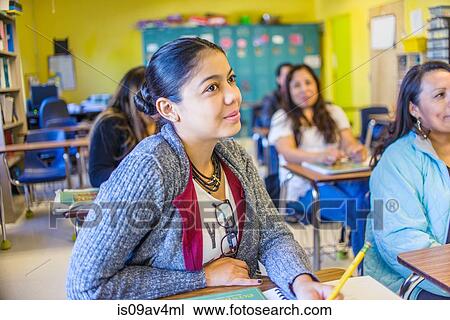 Female and male mature students listening from class desks View Large Photo Image Stock Image - Female and male mature students listening from class desks. Fotosearch