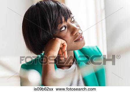 Female designer gazing in creative studio View Large Photo Image Stock Photo - Female designer gazing in creative studio. Fotosearch