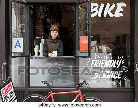 Female employee at service window, Nike and Coffee shop, New York, USA View Large Photo Image Stock Photo - Female employee at service window, Nike and Coffee shop, New York, USA. Fotosearch