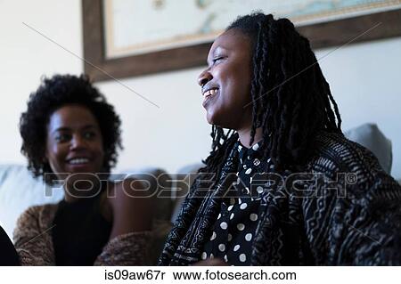 Female friends relaxing at home View Large Photo Image Stock Photography - Female friends relaxing at home. Fotosearch