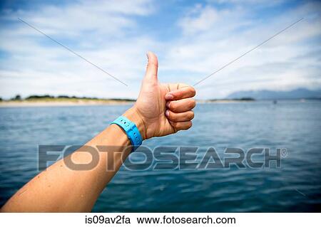 Female hand giving thumbs up over Nehalem Bay, Oregon, USA View Large Photo Image Stock Image - Female hand giving thumbs up over Nehalem Bay, Oregon, USA. Fotosearch