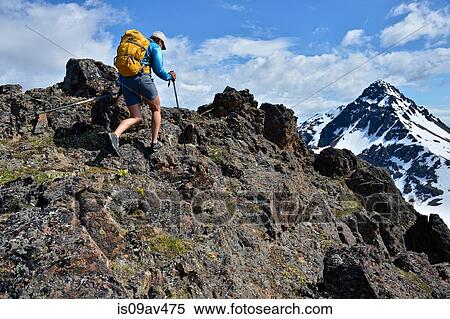 Female mountain climber climbing uphill, rear view, Chugach State Park, Anchorage, Alaska, USA View Large Photo Image Stock Photography - Female mountain climber climbing uphill, rear view, Chugach State Park, Anchorage, Alaska, USA. Fotosearch
