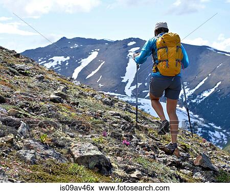 Female mountain climber walking uphill, rear view, Chugach State Park, Anchorage, Alaska, USA View Large Photo Image Stock Photo - Female mountain climber walking uphill, rear view, Chugach State Park, Anchorage, Alaska, USA. Fotosearch