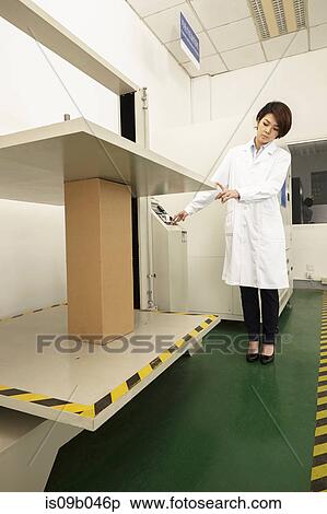 Female technician operating packaging machine in printing and packaging factory, China View Large Photo Image Stock Photography - Female technician operating packaging machine in printing and packaging factory, China. Fotosearch
