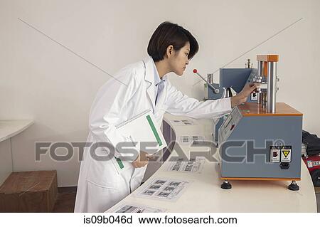 Female technician operating printing machine in printing and packaging factory, China View Large Photo Image Stock Image - Female technician operating printing machine in printing and packaging factory, China. Fotosearch