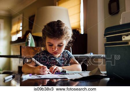 Female toddler at table colouring in colouring book View Large Photo Image Stock Image - Female toddler at table colouring in colouring book. Fotosearch