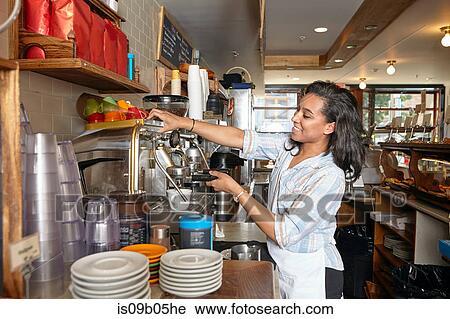 Female worker in bakery, using coffee machine View Large Photo Image Stock Image - Female worker in bakery, using coffee machine. Fotosearch