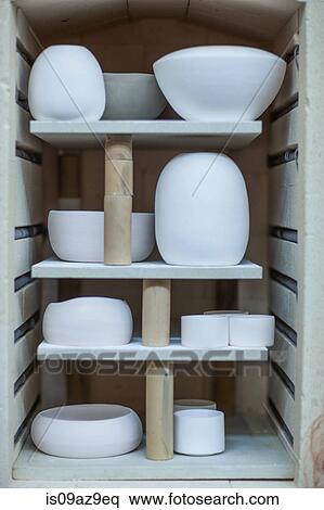Finished pottery vases and bowls in workshop kiln View Large Photo Image Stock Photography - Finished pottery vases and bowls in workshop kiln. Fotosearch