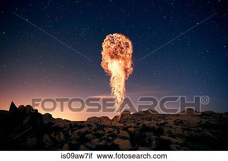 Fire rising up from rocky landscape against starry night sky View Large Photo Image Stock Image - Fire rising up from rocky landscape against starry night sky. Fotosearch