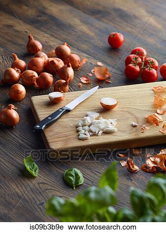Fresh basil and cherry tomatoes with onions chopped on cutting board View Large Photo Image Stock Image - Fresh basil and cherry tomatoes with onions chopped on cutting board. Fotosearch