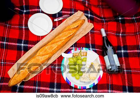 Fresh bread, grapes and wine on picnic blanket, overhead view View Large Photo Image Stock Image - Fresh bread, grapes and wine on picnic blanket, overhead view. Fotosearch