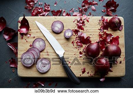 Fresh red onions sliced on cutting board View Large Photo Image Stock Image - Fresh red onions sliced on cutting board. Fotosearch